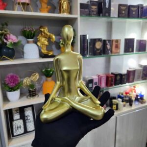 Golden yoga lady statue Nigeria